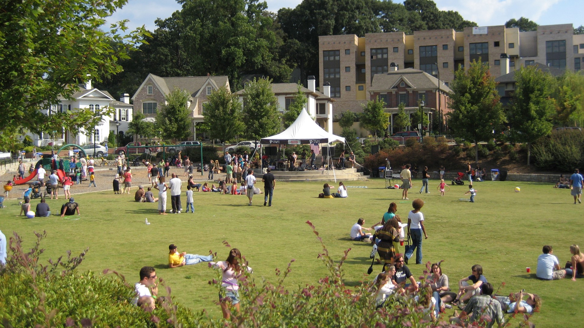 Glenwood Park a new urbanist Sustainable Community by TSW - Open space, park, stormwater detention facility being used as a community gathering space 