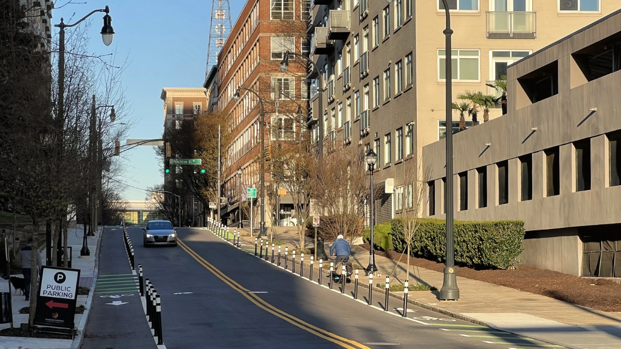 Protected bike lanes along both sides of 5th Street and conflict markings